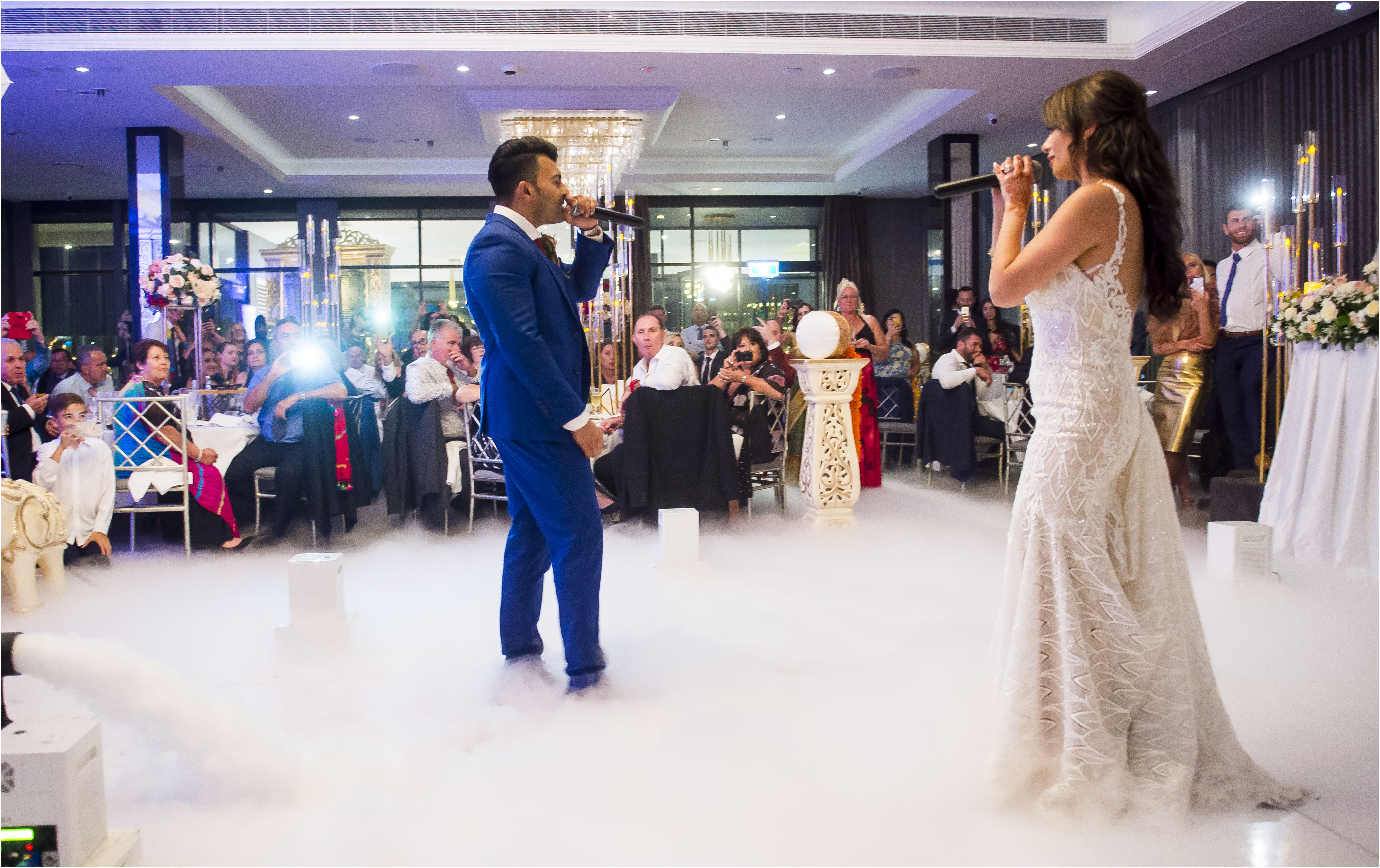 Gorgeous bride and stylish groom dancing under golden confetti at wedding  reception. Happy wedding couple performing first dance in restaurant.  Romantic moments Stock Photo | Adobe Stock