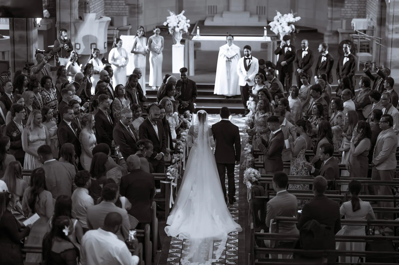 Bride and groom walking the aisle during a church ceremony